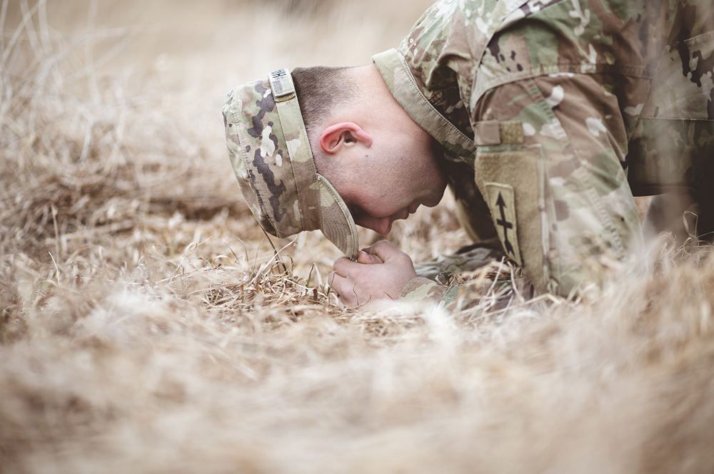 American soldier praying